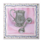 Heirloom Cup & Rattle on Purple Background Ceramic Tile<br><div class="desc">An heriloom cup sits next to a baby rattle in this work by Tara Friel. A figure of a teddy bear is carved into the end of the rattle,  and intricate floral patterns are adorn the sides of the cup. A great piece,  put this on your wall today!</div>