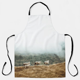 HERD OF SHEEP ON BROWN GRASS FIELD DURING DAYTIME APRON