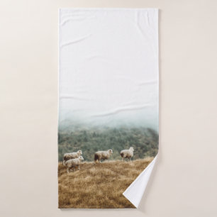 HERD OF SHEEP ON BROWN GRASS FIELD DURING DAYTIME BATH TOWEL