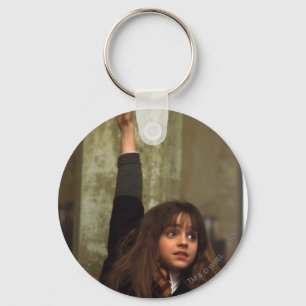 Hermione raises her hand key ring