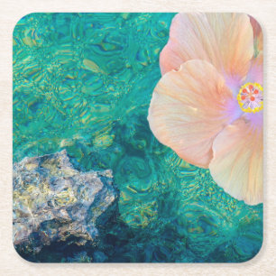 Hibiscus flower on turquoise water coaster