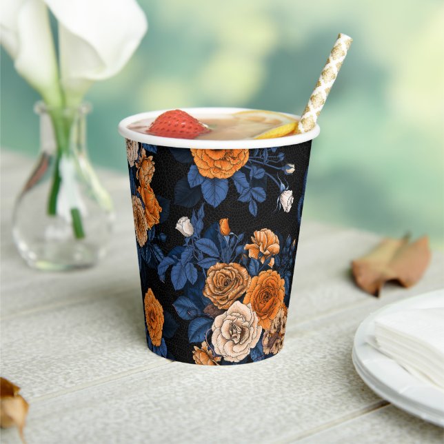Hidden in the roses, orange and blue paper cups (Insitu)