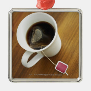 High angle view of a cup of tea metal tree decoration