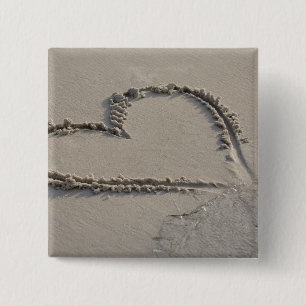 High angle view of a heart shape on the beach 15 cm square badge