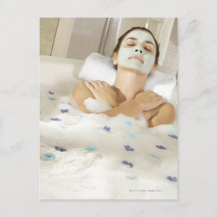 High angle view of a young woman wearing a postcard