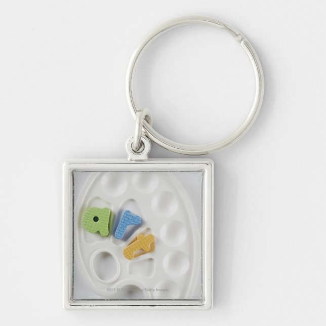 High angle view of alphabets on a palette key ring (Front)