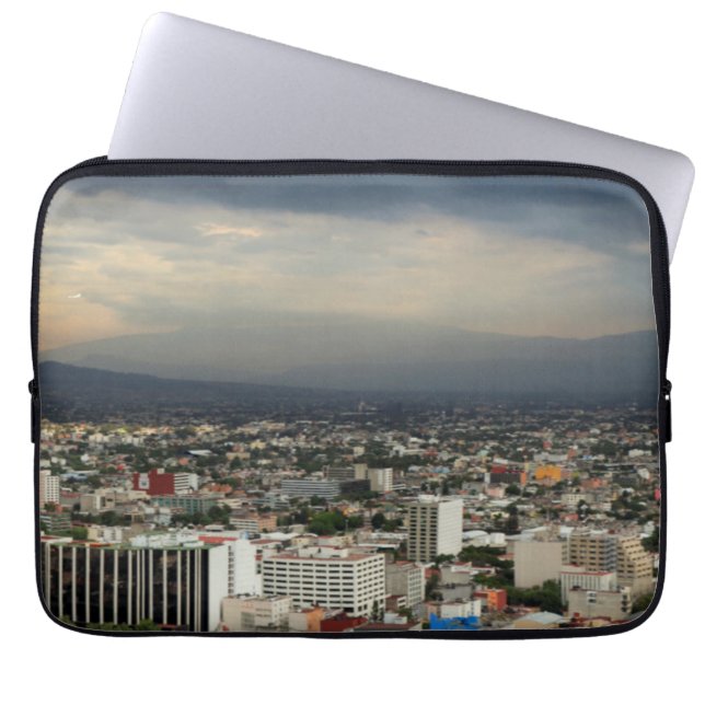 High Angle View Of Cityscape Against Cloudy Sky Laptop Sleeve (Front)