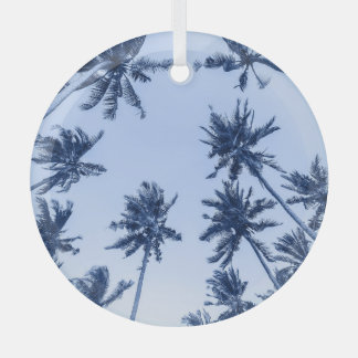 High palm trees, clear blue sky. glass tree decoration