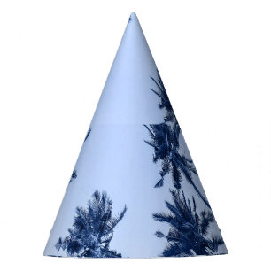 High palm trees, clear blue sky. party hat
