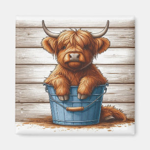 Highland Cow Calf on Blue Bucket Against Wood Wall Magnet