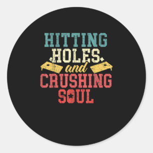 Hitting Holes Crushing Souls Cornhole Player Classic Round Sticker