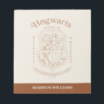 HOGWARTS™ School of Witchcraft and Wizardry Crest Notepad<br><div class="desc">Honor the legacy of the wizarding world with this timeless Hogwarts™ School of Witchcraft & Wizardry crest design. Featuring the iconic four-house shield — lion, serpent, badger, and eagle — this elegant artwork represents the unity and tradition of Gryffindor™, Slytherin™, Hufflepuff™, and Ravenclaw™. Rendered in a refined, vintage-inspired line style,...</div>