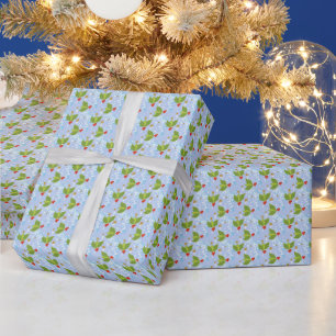 Holly berries snow stars blue background pattern wrapping paper