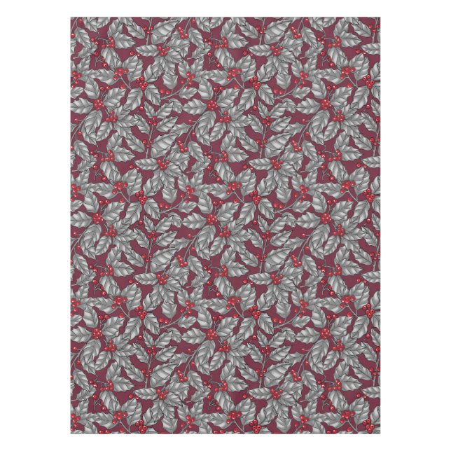 Holly berry, grey leaves on dark red tablecloth (Front)