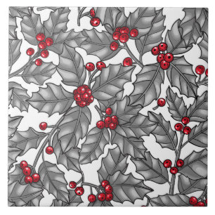 Holly berry, grey leaves on white ceramic tile