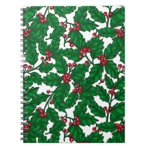 Holly berry on white notebook