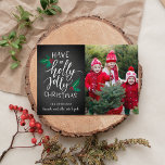 Holly Jolly | Holiday Photo Collage Card<br><div class="desc">Festive holiday photo card features your favourite photo aligned at the right,  with "have a holly jolly Christmas" in hand lettered typography accented with red and green holly leaves and berries on a rustic chalkboard background. Personalise with your names beneath,  and add an additional photo to the back.</div>