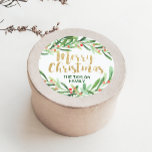 Holly Wreath Merry Christmas Classic Round Sticker<br><div class="desc">These holly wreath merry christmas stickers are perfect for a classic holiday card or gift. The design features a watercolor green wreath with red berries and an elegant faux gold glitter font. Personalise the stickers with your name. Please Note: This design does not feature real gold glitter. It is a...</div>