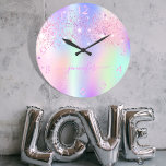 Holographic unicorn glitter rainbow monogram large clock<br><div class="desc">A trendy holographic background with unicorn and rainbow pastel colours in pink, purple, rose gold, mint green. Decorated with faux glitter dust in pink and purple. Personalise and add a name, written with a modern hand lettered style script with swashes. Pink coloured letters. To keep the swashes only delete the...</div>