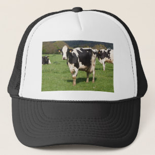 Holstein cows in a field in Brittany Trucker Hat