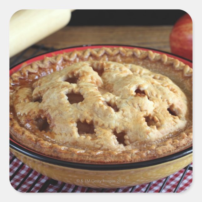 Home baked apple pie on cooling rack with apple square sticker (Front)