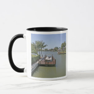 Homes and docks on canal Marco Island Florida Mug