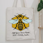 Honeybee Honeycomb Bee Farm Apiary Personalised Tote Bag<br><div class="desc">This honeybee tote bag has a large bee over a light, bright honeycomb background. The yellow and black bee has white-blue wings that spread out like it's ready to fly. The background is a pretty golden beehive honeycomb shape. Use the template to add any text you like, such as your...</div>