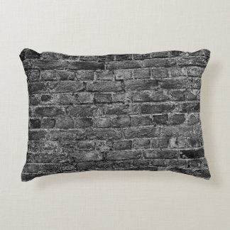 horizontal part of black painted brick wallwall,br decorative cushion