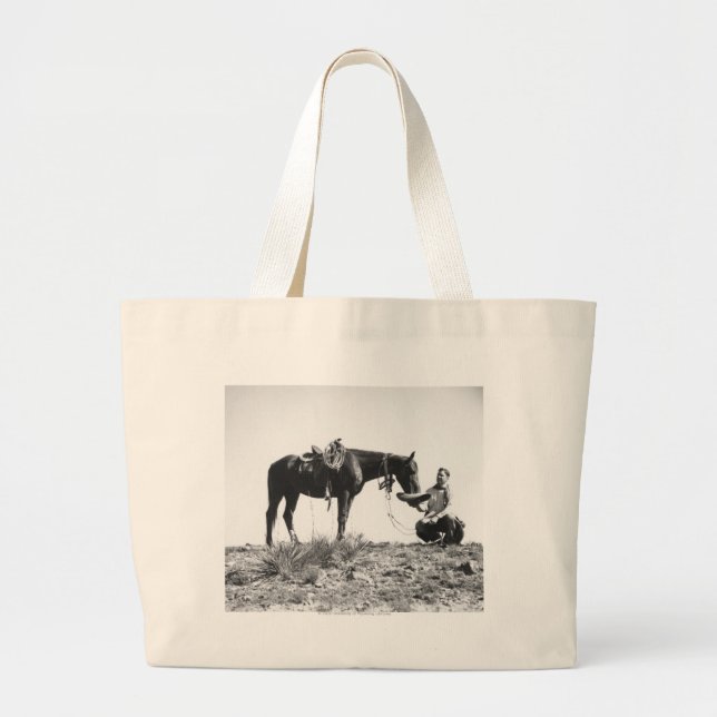 Horse eating from a cowboy's hat. large tote bag (Front)