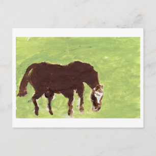 Horse grazing on green background postcard