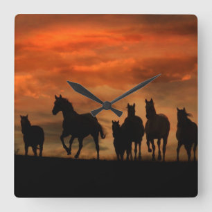 Horses at sunset running clock