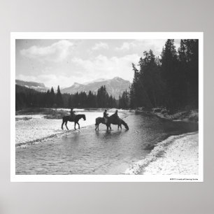Horses drinking from and crossing a river poster