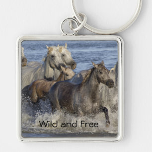 Horses galloping in the water key ring