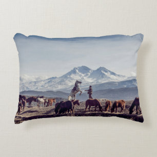 HORSES IN BROWN OPEN FIELD VIEWING MOUNTAIN AT DAY DECORATIVE CUSHION