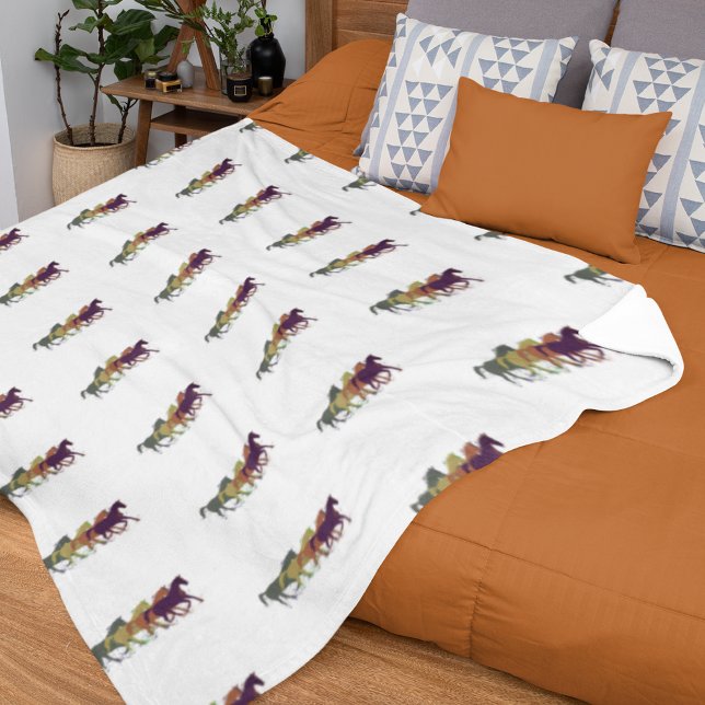 Horses running across white fleece blanket (Creator Uploaded)