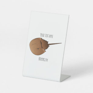 Horseshoe crab cartoon illustration pedestal sign