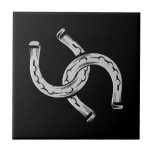 Horseshoes on Black Ceramic Tile