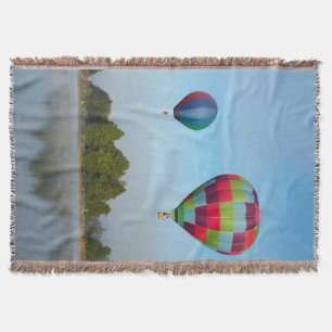 Hot air balloons over a lake,  NZ Throw Blanket