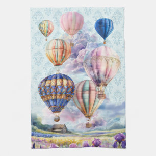 Hot Air Balloons Over Scenic Countryside Tea Towel