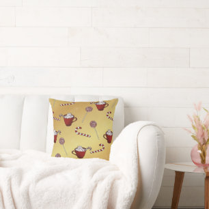 Hot chocolate and candy cane on faux golden  cushion