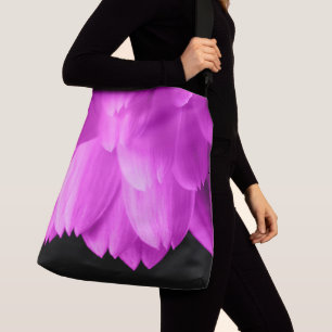 Hot pink flower petals on black crossbody bag
