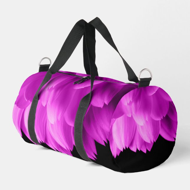 Hot pink flower petals on black duffle bag (Left Corner)