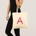 Hot Pink Modern Script Girly Monogram Name Tote Bag<br><div class="desc">The perfect blend of style and practicality, this personalised tote bag features a striking hot pink monogram set against a soft blush background. Ideal for the discerning individual who values both form and function, this bag is as versatile as it is chic. Whether you're heading to the market, the gym,...</div>