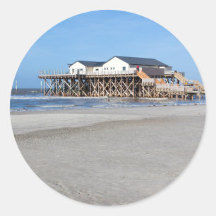 House on stilts at the beach of St. Peter Ording Classic Round Sticker