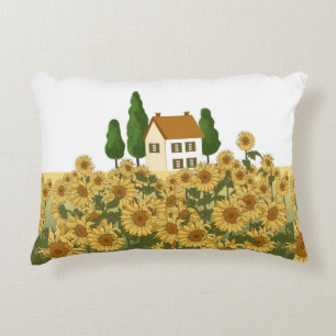 House, tall trees and a field of sunflowers in the decorative cushion