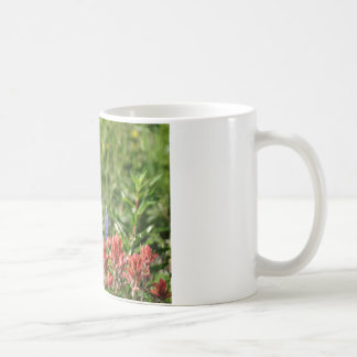 Hummingbird in wild flowers coffee mug