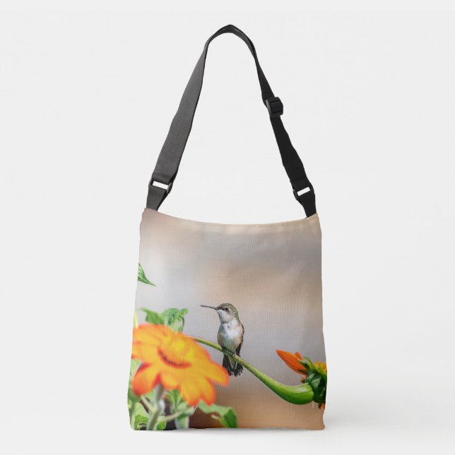 Hummingbird on a flowering plant crossbody bag (Front)