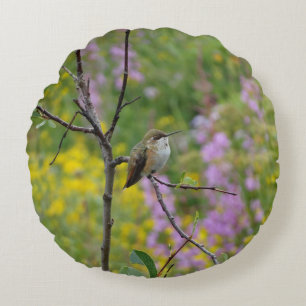 Hummingbird purple pink floral background round cushion