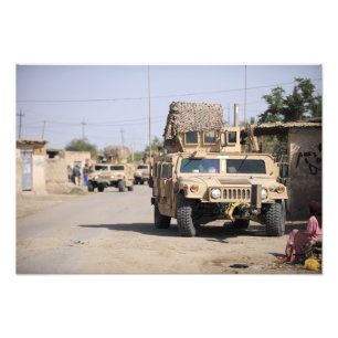 Humvee's conduct security during a patrol photo print