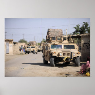 Humvee's conduct security during a patrol poster